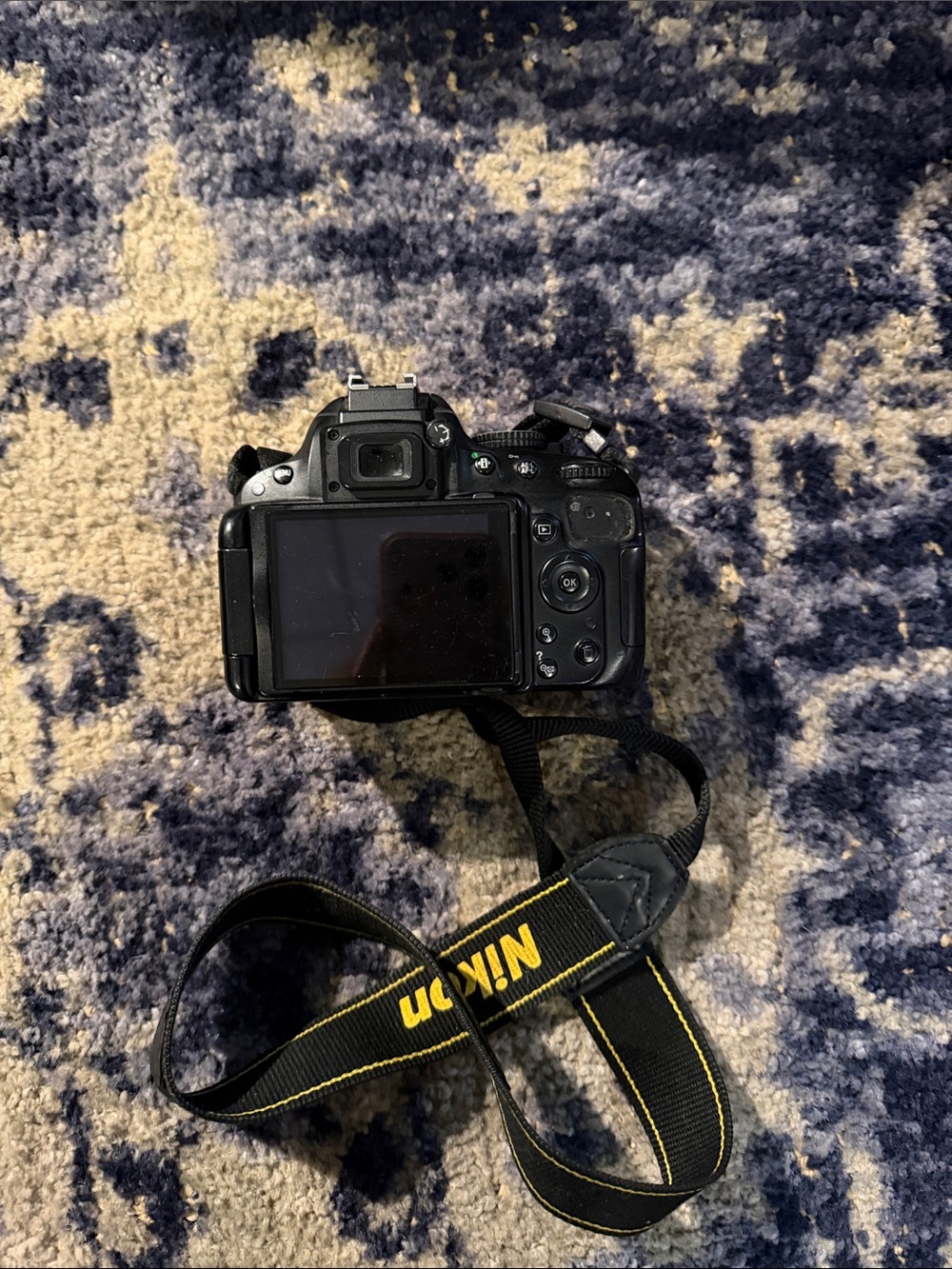 Nikon DSLR Camera with Black and Yellow Strap